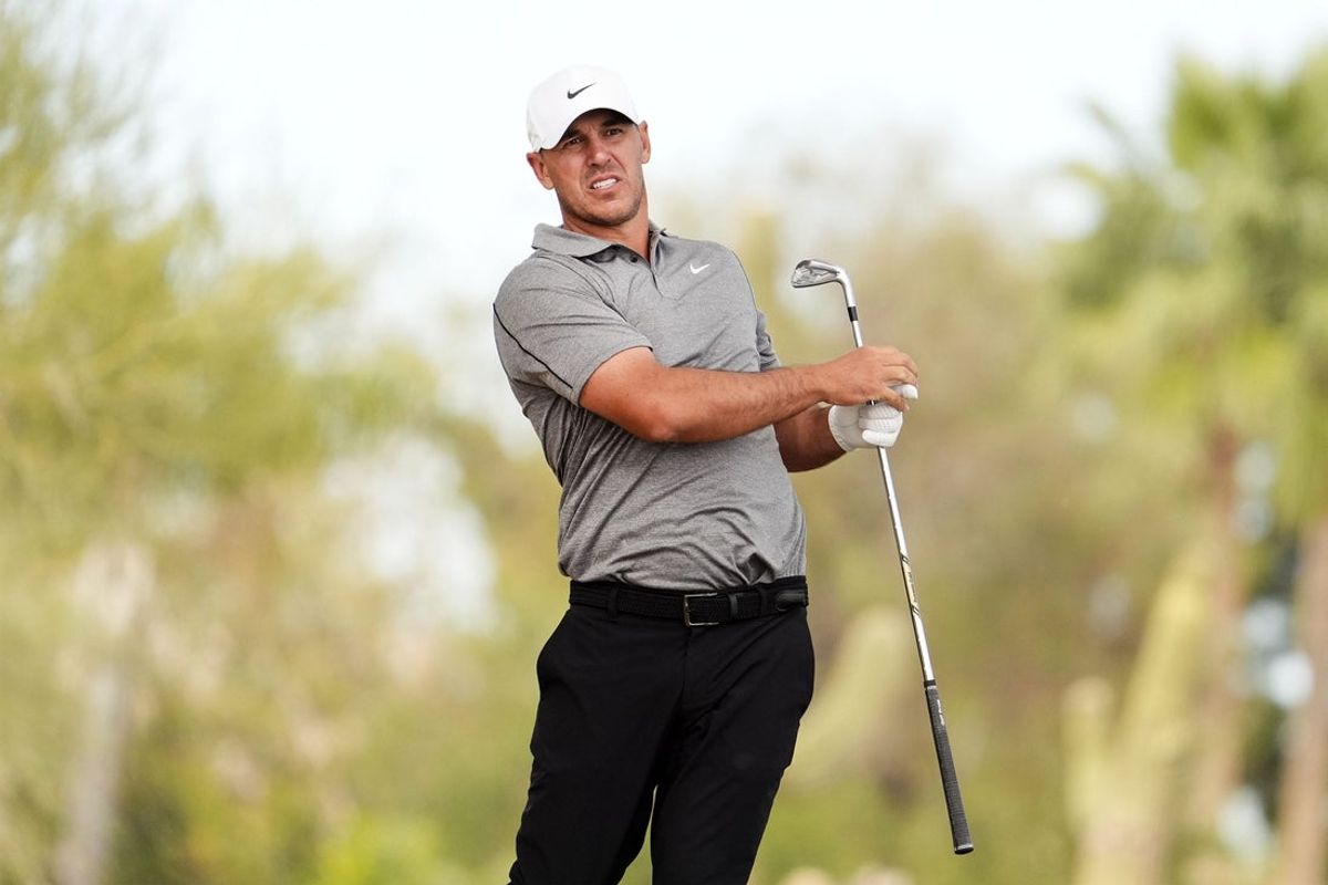 Brooks Koepka plays his second shot on the second hole during round one at the WM Phoenix Open on Feb. 5, 2026, at TPC Scottsdale.