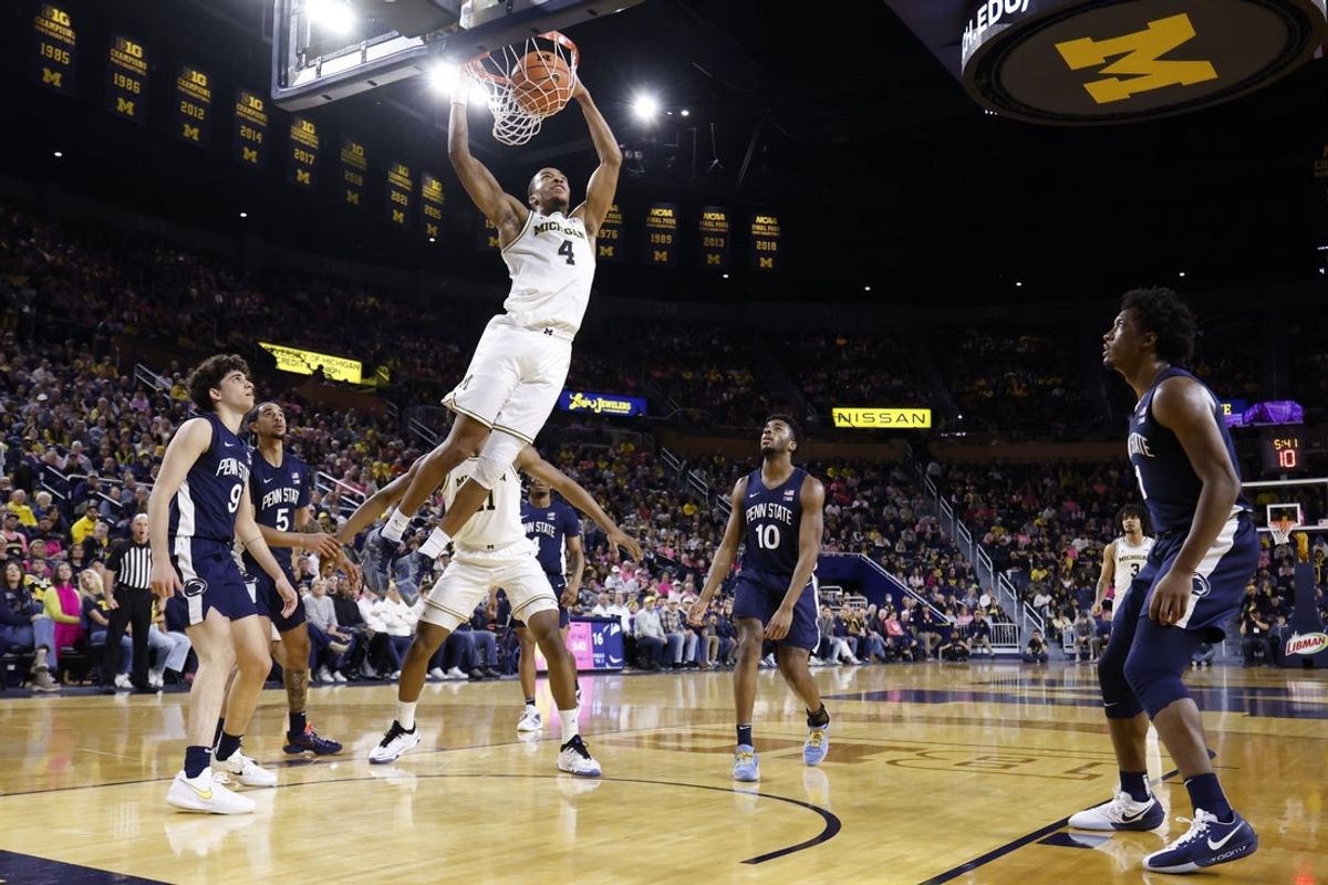 Feb 5, 2026; Ann Arbor, Michigan, USA;  Michigan Wolverines guard Nimari Burnett (4) dunks in the first half against the Penn State Nittany Lions at Crisler Center. Mandatory Credit: Rick Osentoski-Imagn Images