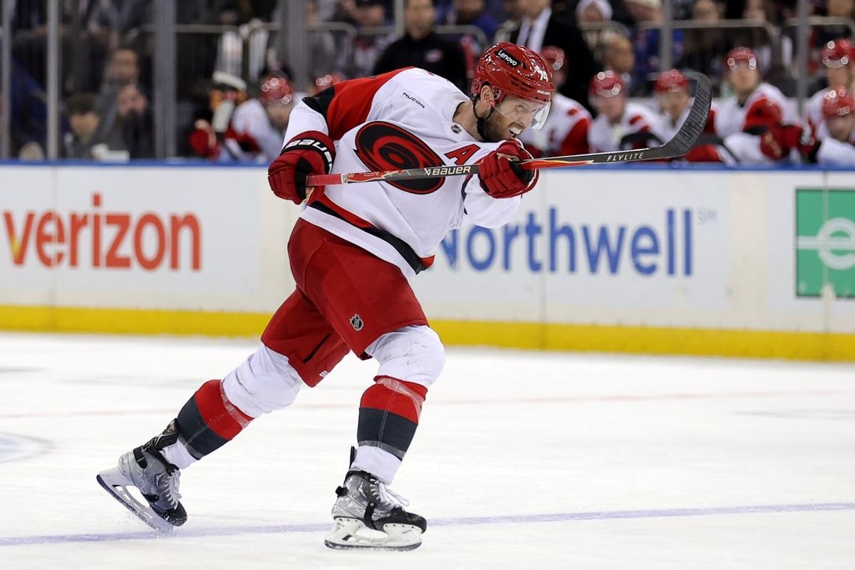 Feb 5, 2026; New York, New York, USA; Carolina Hurricanes defenseman Jaccob Slavin (74) follows through on a shot against the New York Rangers during the third period at Madison Square Garden. Mandatory Credit: Brad Penner-Imagn Images