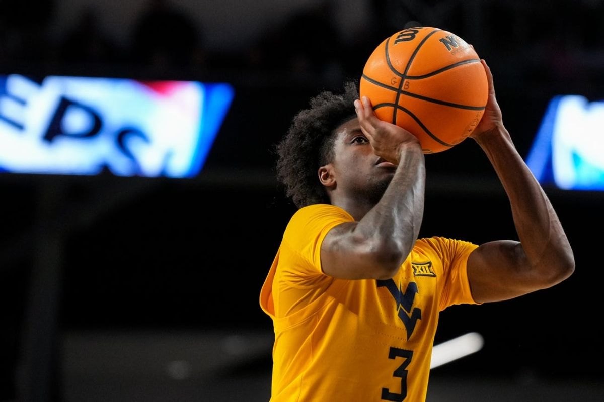 Feb 5, 2026; Cincinnati, Ohio, USA;  West Virginia Mountaineers guard Honor Huff (3) attempts a free throw against the Cincinnati Bearcats in the second half at Fifth Third Arena. Mandatory Credit: Aaron Doster-Imagn Images