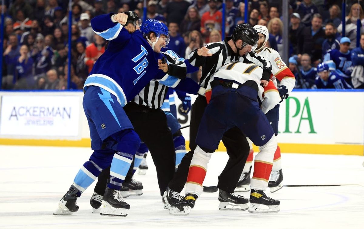Feb 5, 2026; Tampa, Florida, USA; Tampa Bay Lightning center Curtis Douglas (42) and Florida Panthers defenseman Niko Mikkola (77) fight during the third period at Benchmark International Arena. Mandatory Credit: Kim Klement Neitzel-Imagn Images