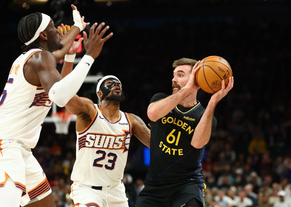 Feb 5, 2026; Phoenix, Arizona, USA; Golden State Warriors guard Pat Spencer (61) against Phoenix Suns guard Jordan Goodwin (23) in the first half at Mortgage Matchup Center. Mandatory Credit: Mark J. Rebilas-Imagn Images