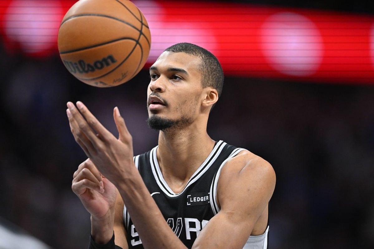 Feb 5, 2026; Dallas, Texas, USA; San Antonio Spurs forward Victor Wembanyama (1) attempts a free throw during the second half against the Dallas Mavericks at the American Airlines Center. Mandatory Credit: Jerome Miron-Imagn Images