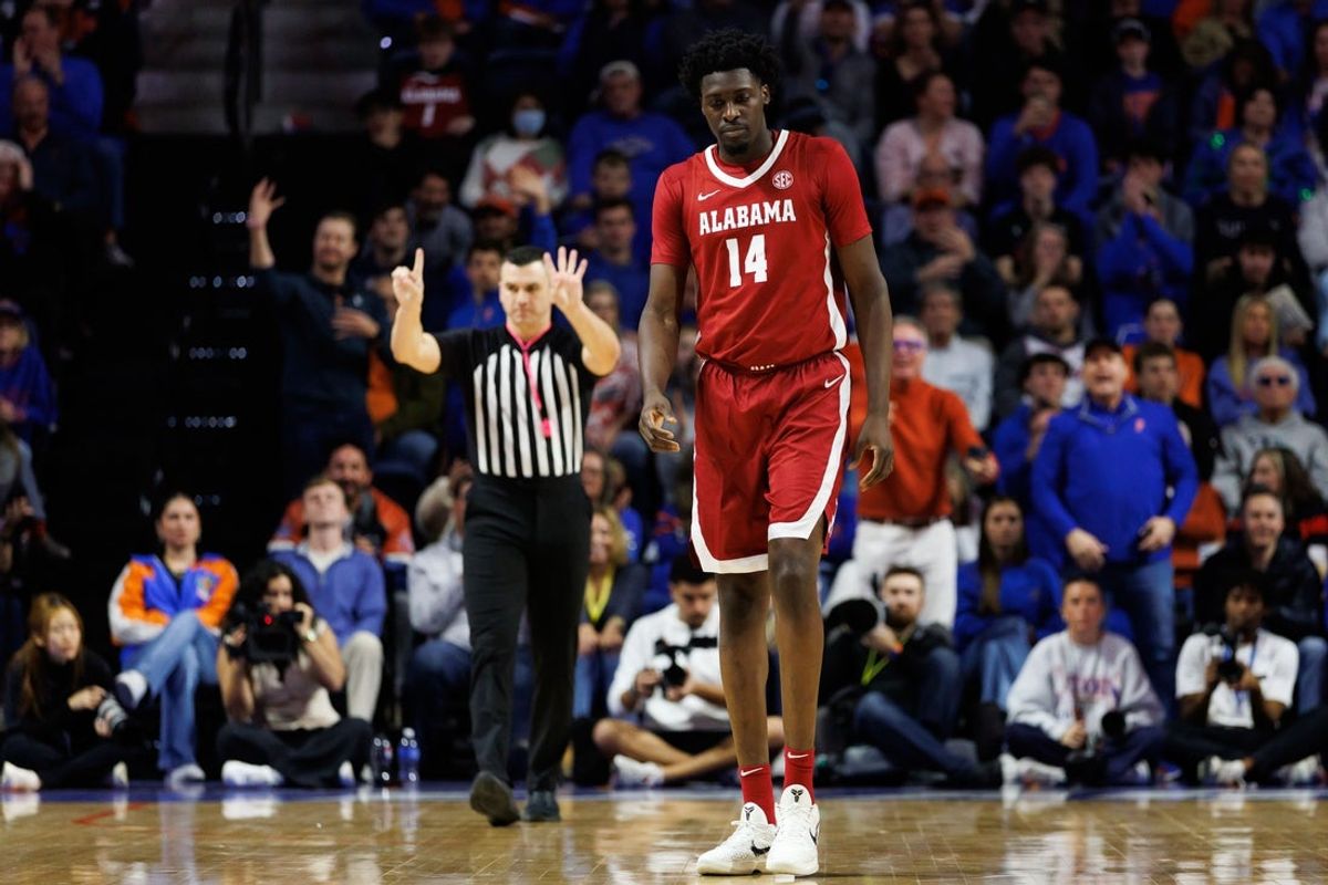 Feb 1, 2026; Gainesville, Florida, USA; Alabama Crimson Tide center Charles Bediako (14) reacts after a foul call by the referee against the Florida Gators during the second half at Exactech Arena at the Stephen C. O'Connell Center. Mandatory Credit: Matt Pendleton-Imagn Images