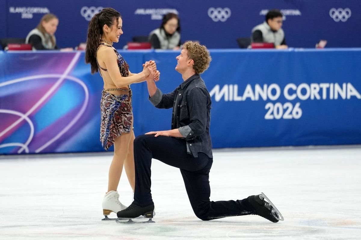 Feb 6, 2026; Milan, Italy; Madison Chock and Evan Bates of the United States compete in ice dance rhythm dance during the Milano Cortina 2026 Olympic Winter Games at Milano Ice Skating Arena. Mandatory Credit: James Lang-Imagn Images