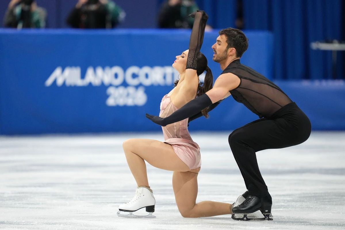 Feb 6, 2026; Milan, Italy; Guillaume Cizeron and Laurence Fournier Beaudry of France compete in ice dance rhythm dance during the Milano Cortina 2026 Olympic Winter Games at Milano Ice Skating Arena. Mandatory Credit: James Lang-Imagn Images