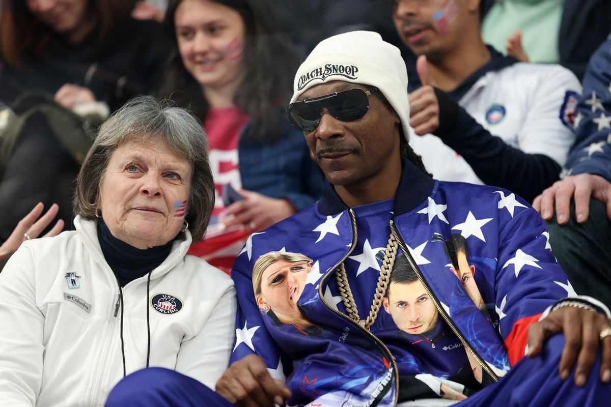 [US, Mexico & Canada customers only] Feb 6, 2026; Cortina d'Ampezzo, ITALY; Snoop Dogg watches a match of Korey Dropkin of United States with Cory Thiesse of United States against Brett Gallant of Canada and Jocelyn Peterman of Canada  during the curling mixed doubles round robin competition during the Milano Cortina 2026 Olympic Winter Games at the Cortina Curling Olympic Stadium. Mandatory Credit: Issei Kato/Reuters via Imagn Images