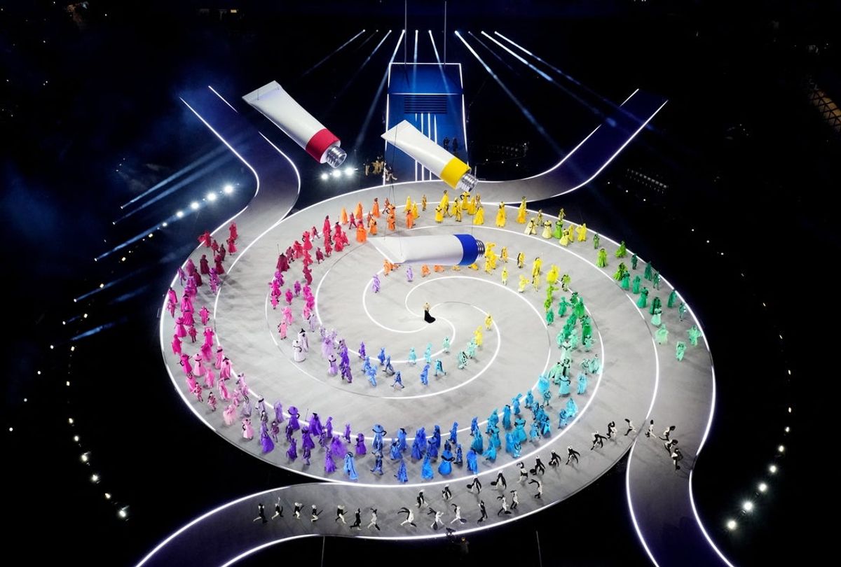[US, Mexico & Canada customers only] Feb 6, 2026; Milan, ITALY; Fabric pours out from three tubes of paint from above as performers walk on stage during the opening ceremony during the Milano Cortina 2026 Olympic Winter Games. Mandatory Credit: Fabrizio Bensch/Reuters via Imagn Images