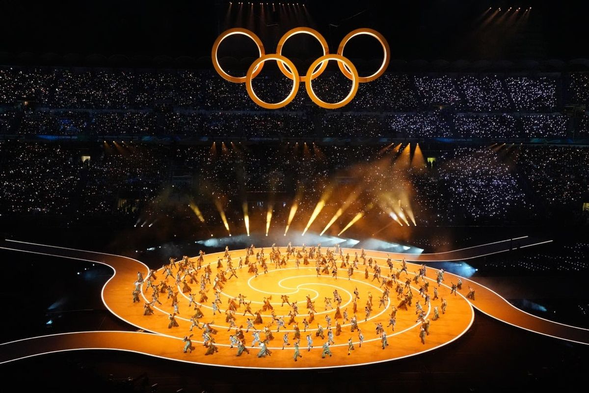 Feb 6, 2026; Milan, ITALY; Dancers perform during the Olympic rings segment during the Opening Ceremony for the Milano Cortina 2026 Olympic Winter Games at Milano San Siro Olympic Stadium. Mandatory Credit: Amber Searls-Imagn Images