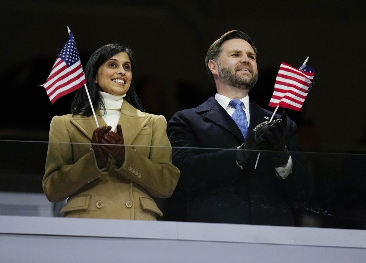 Feb 6, 2026; Milan, ITALY;  United States Vice President JD Vance and second lady Usha Vance wave American flags during the Opening Ceremony for the Milano Cortina 2026 Olympic Winter Games at Milano San Siro Olympic Stadium. Mandatory Credit: Vincent Alban/Pool via Imagn Images