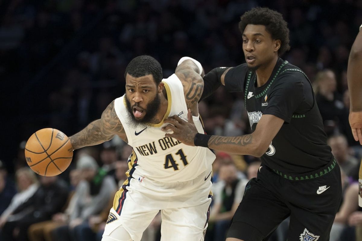 Feb 6, 2026; Minneapolis, Minnesota, USA; New Orleans Pelicans guard Saddiq Bey (41) dribbles the ball past Minnesota Timberwolves forward Jaden McDaniels (3) in the first half at Target Center. Mandatory Credit: Jesse Johnson-Imagn Images