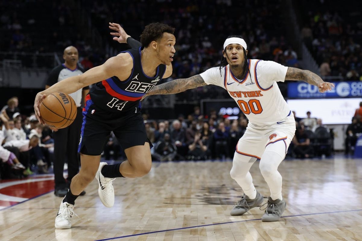 Feb 6, 2026; Detroit, Michigan, USA;  Detroit Pistons forward Wendell Moore Jr. (14) dribbles on New York Knicks guard Jordan Clarkson (00) in the second half at Little Caesars Arena. Mandatory Credit: Rick Osentoski-Imagn Images