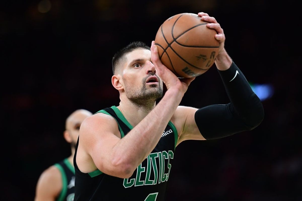 Feb 6, 2026; Boston, Massachusetts, USA;  Boston Celtics center Nikola Vucevic (4) shoots a free throw during the second half against the Miami Heat at TD Garden. Mandatory Credit: Bob DeChiara-Imagn Images