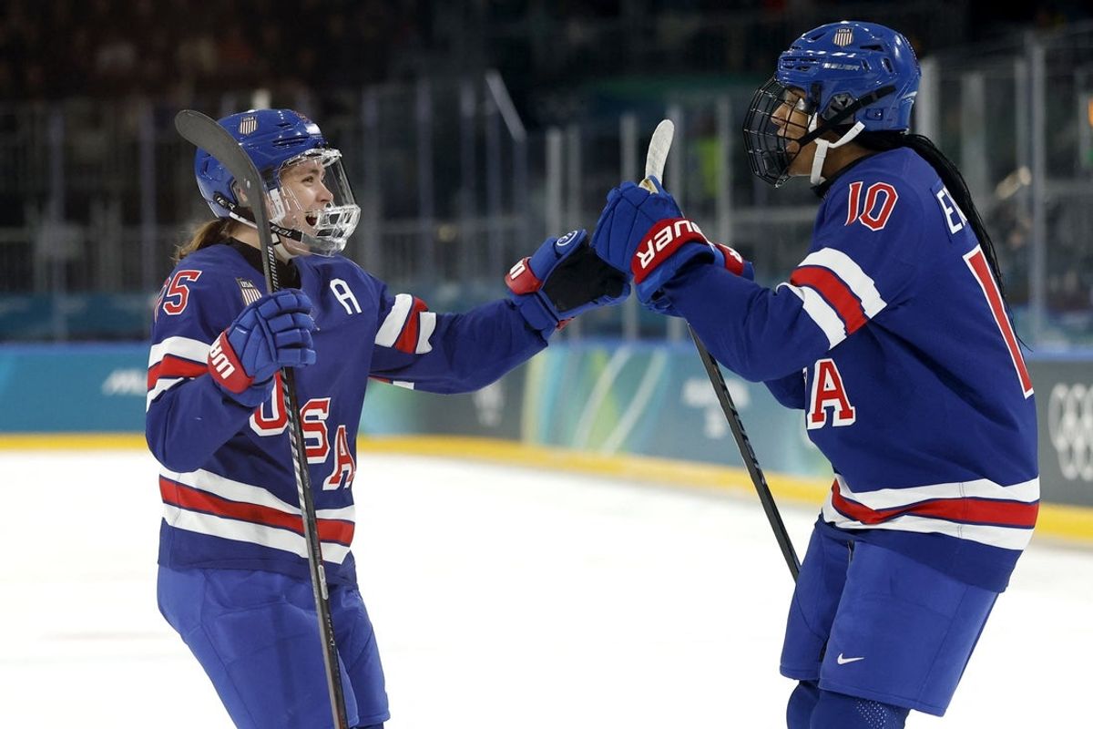Feb 7, 2026; Milan, Italy; Alex Carpenter (25) of the United States celebrates with Laila Edwards (10) of the United States after scoring a goal against Finland in women's ice hockey group A play during the Milano Cortina 2026 Olympic Winter Games at Milano Rho Ice Hockey Arena. Mandatory Credit: Geoff Burke-Imagn Images