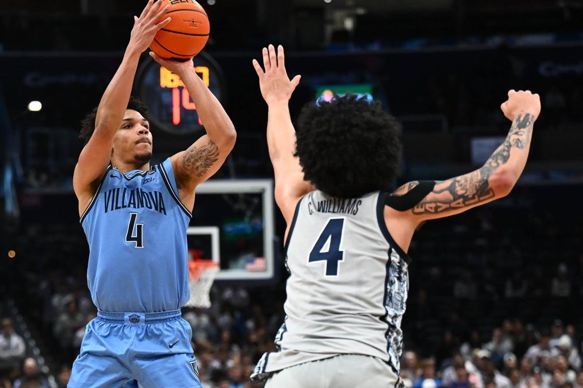 Feb 7, 2026; Washington, District of Columbia, USA; Villanova Wildcats guard Tyler Perkins (4) shoots over Georgetown Hoyas forward Caleb Williams (4) during the first half at Capital One Arena. Mandatory Credit: Brad Mills-Imagn Images
