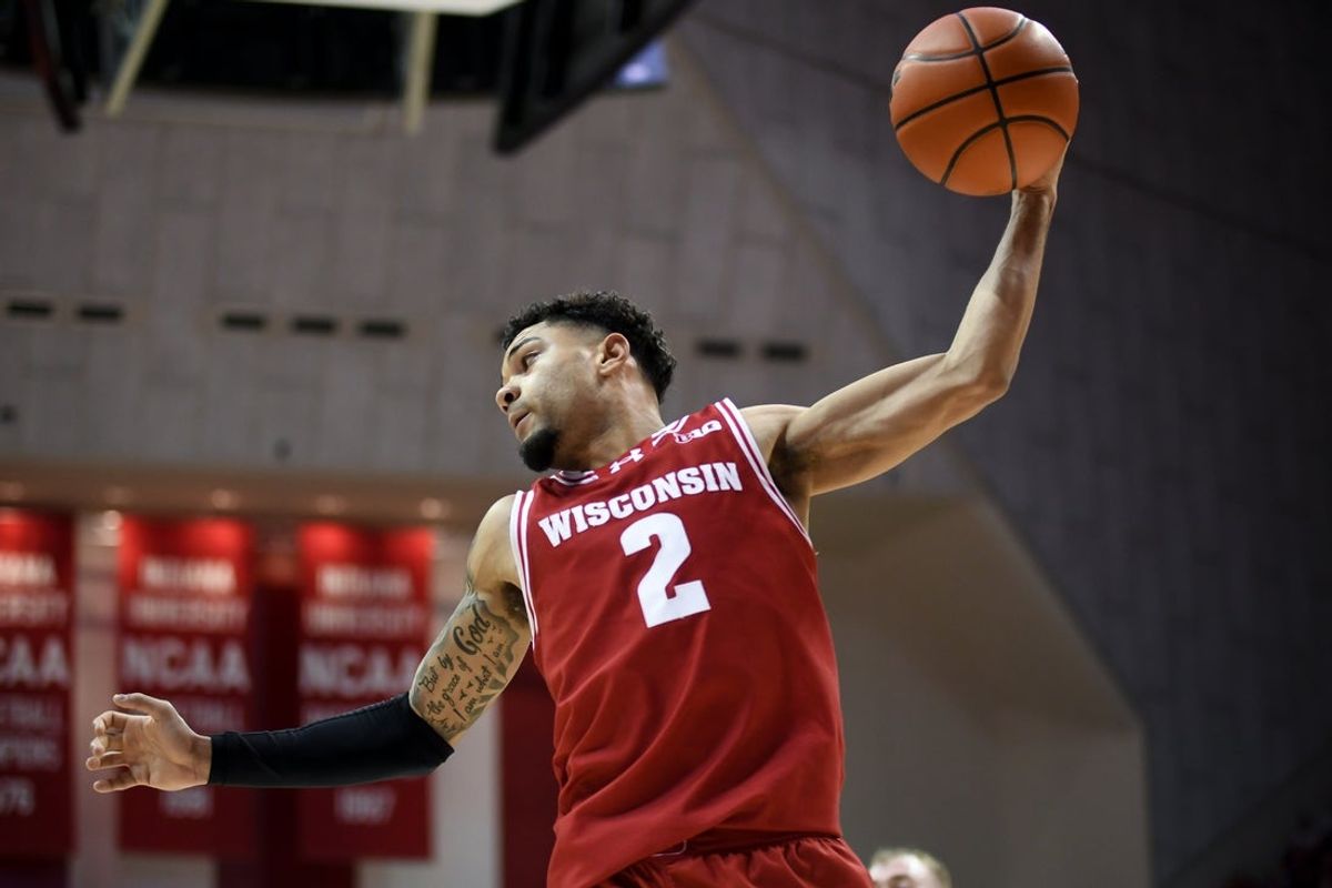 Feb 7, 2026; Bloomington, Indiana, USA; Wisconsin Badgers guard Nick Boyd (2) rebounds the ball against the Indiana Hoosiers during the first half at Simon Skjodt Assembly Hall. Mandatory Credit: Robert Goddin-Imagn Images