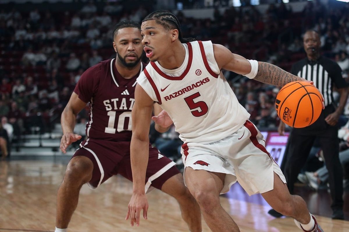 Feb 7, 2026; Starkville, Mississippi, USA; Arkansas Razorbacks guard Darius Acuff Jr. (5) drives to the basket as Mississippi State Bulldogs guard Jayden Epps (10) defends during the first half at Humphrey Coliseum. Mandatory Credit: Petre Thomas-Imagn Images