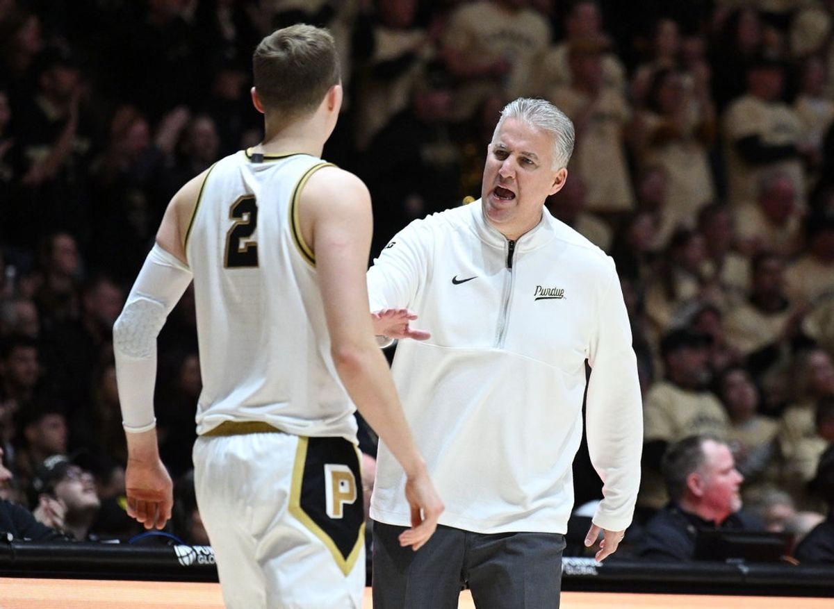 Feb 7, 2026; West Lafayette, Indiana, USA; Purdue Boilermakers head coach Matt Painter talks with guard Fletcher Loyer (2) during the first half against the Oregon Ducks at Mackey Arena. Mandatory Credit: Marc Lebryk-Imagn Images