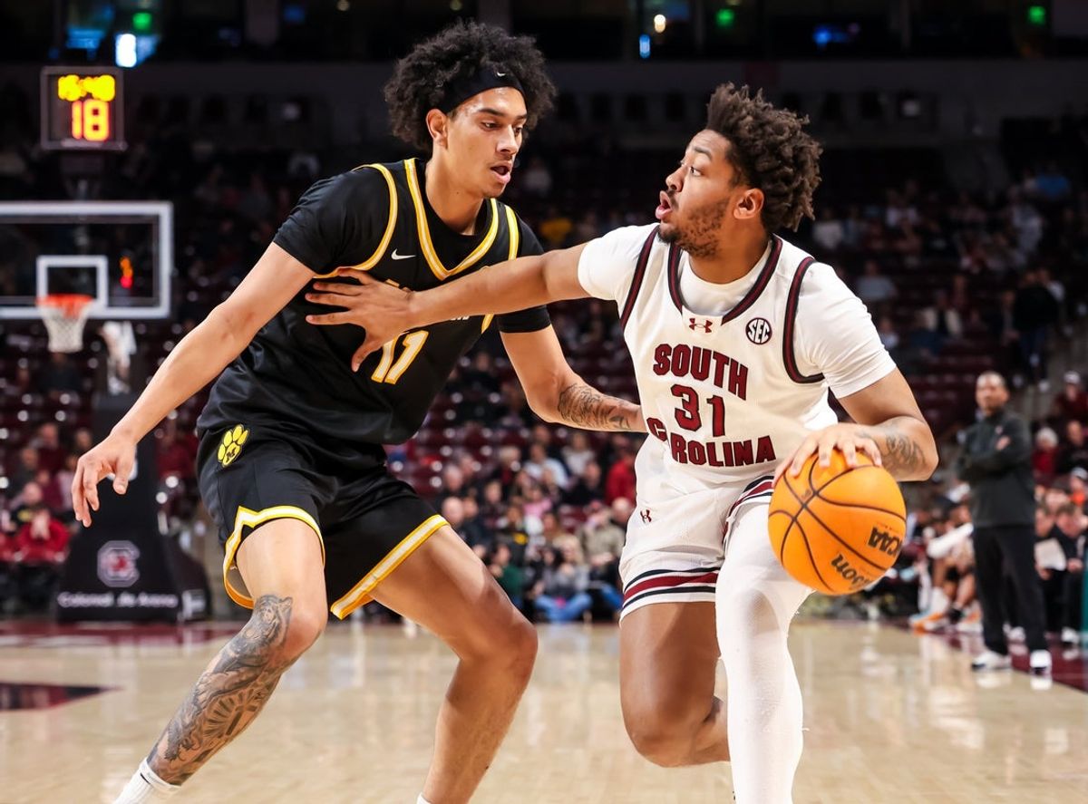 Feb 7, 2026; Columbia, South Carolina, USA; South Carolina Gamecocks forward Elijah Strong (31) attempts to drive around Missouri Tigers forward Trent Pierce (11) in the first half at Colonial Life Arena. Mandatory Credit: Jeff Blake-Imagn Images