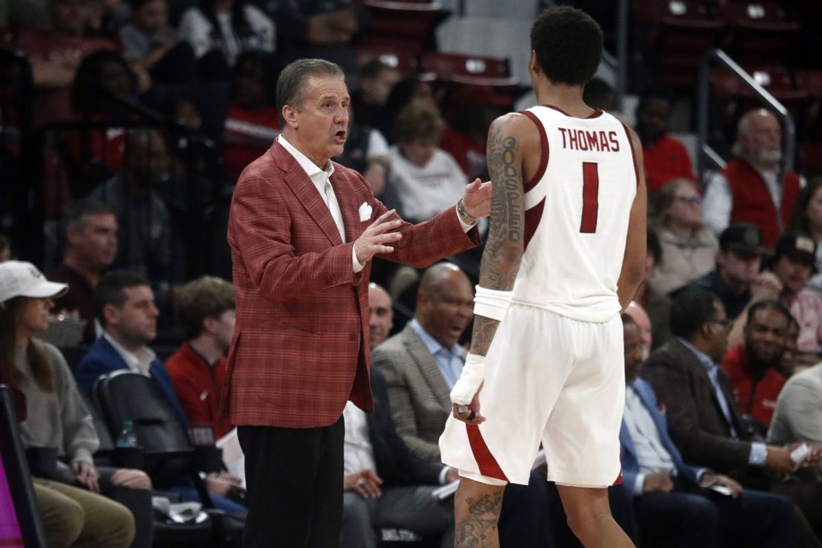 Feb 7, 2026; Starkville, Mississippi, USA; Arkansas Razorbacks head coach John Calipari talks with guard Meleek Thomas (1) during the second half against the Mississippi State Bulldogs at Humphrey Coliseum. Mandatory Credit: Petre Thomas-Imagn Images