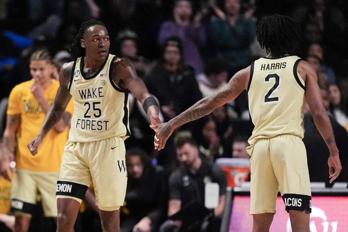 Feb 7, 2026; Winston-Salem, North Carolina, USA; Wake Forest Demon Deacons forward Tre'von Spillers (25) reacts to his go ahead score with forward Juke Harris (2) during the second half against the Louisville Cardinals at Lawrence Joel Veterans Memorial Coliseum. Mandatory Credit: Jim Dedmon-Imagn Images