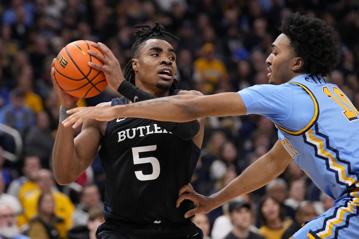Feb 7, 2026; Milwaukee, Wisconsin, USA;  Marquette Golden Eagles guard Adrien Stevens (10) defends Butler Bulldogs forward Michael Ajayi (5) during the first half at Fiserv Forum. Mandatory Credit: Jeff Hanisch-Imagn Images
