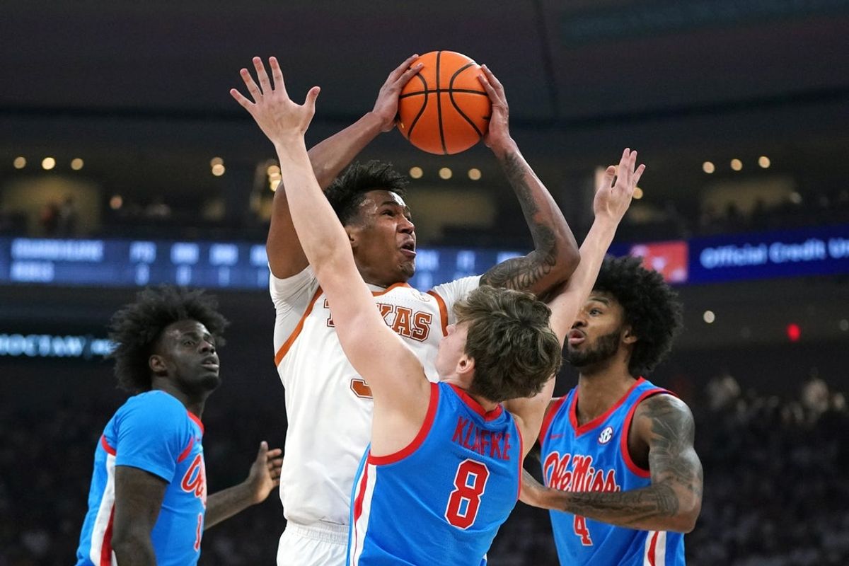 Feb 7, 2026; Austin, Texas, USA; Texas Longhorns guard Dailyn Swain (3) takes a jump shot against Mississippi Rebels guard Eduardo Klafke (8) during the first half at Moody Center. Mandatory Credit: Dustin Safranek-Imagn Images