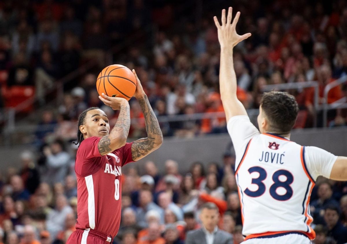Alabama Crimson Tide guard Labaron Philon Jr. (0) takes a jump shot as Auburn Tigers take on Alabama Crimson Tide at Neville Arena in Auburn, Ala. on Saturday, Feb. 7, 2026.