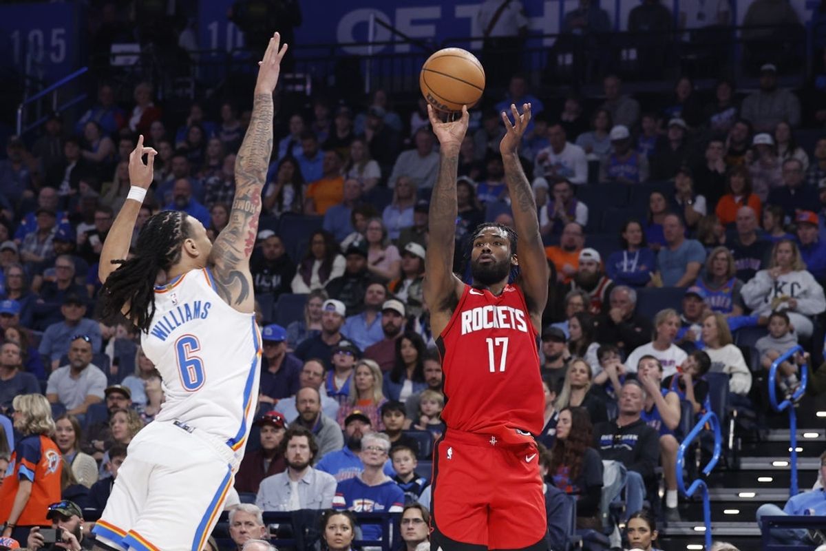 Feb 7, 2026; Oklahoma City, Oklahoma, USA; Houston Rockets forward Tari Eason (17) shoots a three point basket as Oklahoma City Thunder forward Jaylin Williams (6) defends during the second half at Paycom Center. Mandatory Credit: Alonzo Adams-Imagn Images