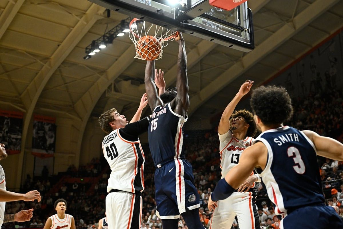 Feb 7, 2026; Corvallis, Oregon, USA; Gonzaga Bulldogs forward Graham Ike (15) dunks the ball over Oregon State Beavers center Noah Amenhauser (40) during the first half at Gill Coliseum. Mandatory Credit: Craig Strobeck-Imagn Images