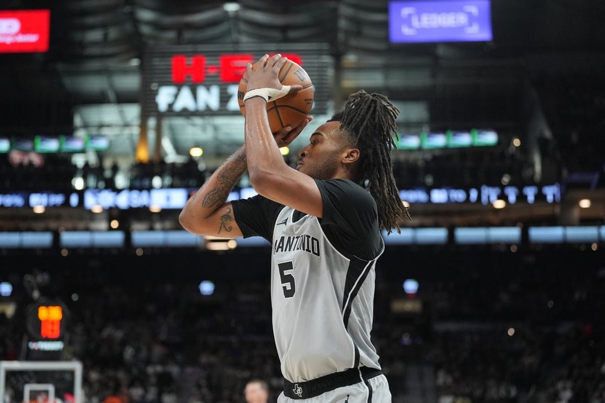 Feb 7, 2026; San Antonio, Texas, USA;  San Antonio Spurs guard Stephon Castle (5) shoots in the first half against the Dallas Mavericks at Frost Bank Center. Mandatory Credit: Daniel Dunn-Imagn Images