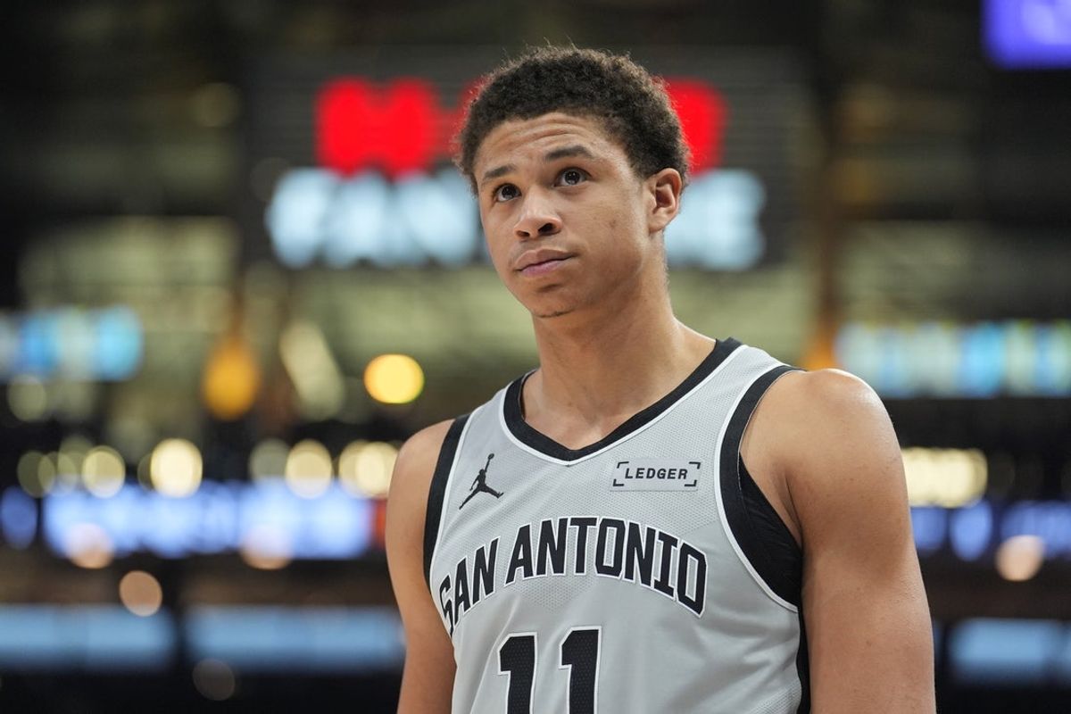 Feb 7, 2026; San Antonio, Texas, USA;  San Antonio Spurs forward Carter Bryant (11) looks up in the first half against the Dallas Mavericks at Frost Bank Center. Mandatory Credit: Daniel Dunn-Imagn Images