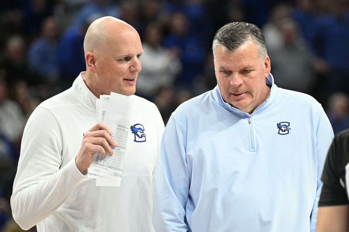 Feb 7, 2026; Omaha, Nebraska, USA;  Creighton Bluejays head coach Greg McDermott and assistant coach Alan Huss meet during a break in the game against the Seton Hall Pirates during the second half at CHI Health Center Omaha. Mandatory Credit: Steven Branscombe-Imagn Images