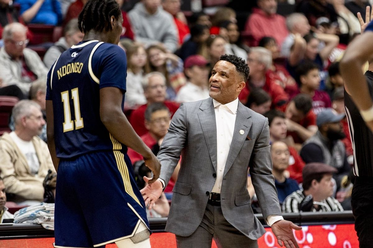 Feb 7, 2026; Stanford, California, USA;  Georgia Tech Yellow Jackets head coach Damon Stoudamire reacts as he talks with forward Baye Ndongo (11) during a timeout in the first half against the Stanford Cardinal at Maples Pavilion. Mandatory Credit: John Hefti-Imagn Images