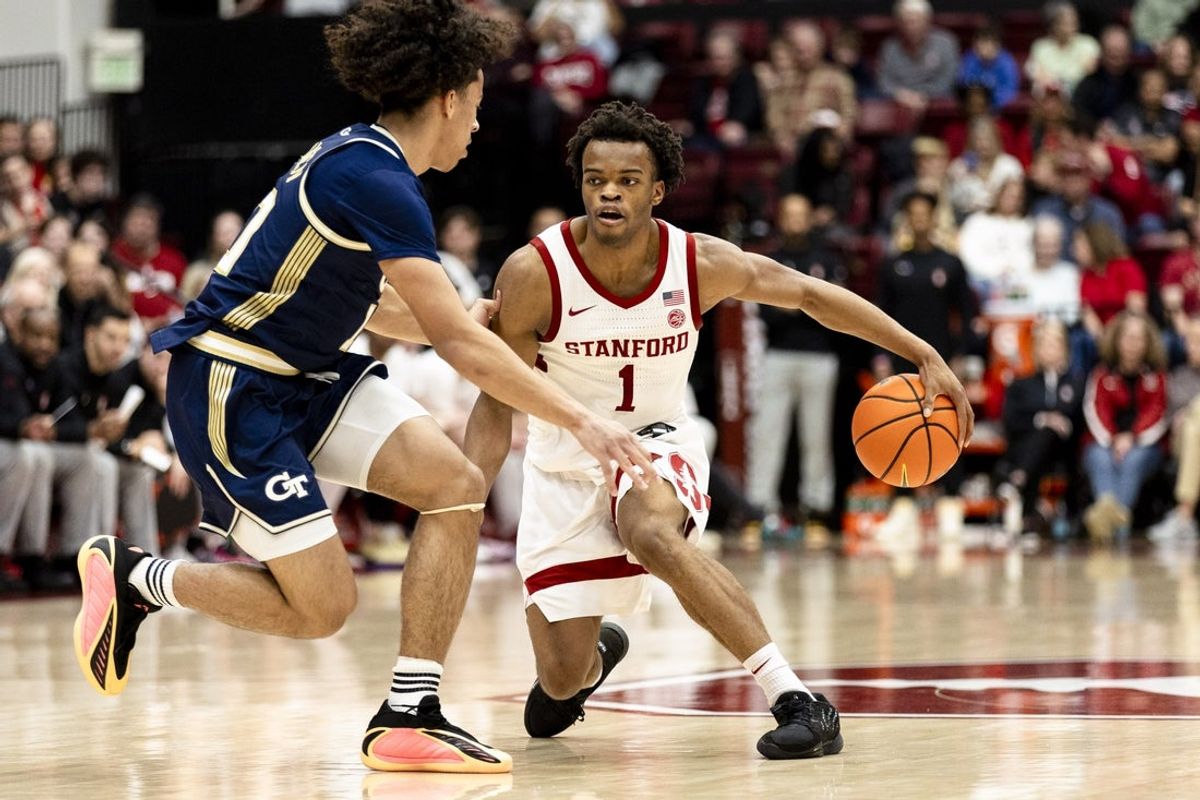 Feb 7, 2026; Stanford, California, USA;  Georgia Tech Yellow Jackets guard Akai Fleming (0) defends Stanford Cardinal guard Ebuka Okorie (1) during the first half at Maples Pavilion. Mandatory Credit: John Hefti-Imagn Images