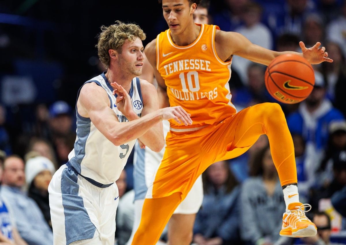 Feb 7, 2026; Lexington, Kentucky, USA; Kentucky Wildcats guard Collin Chandler (5) passes the ball against Tennessee Volunteers forward Nate Ament (10) during the first half at Rupp Arena at Central Bank Center. Mandatory Credit: Jordan Prather-Imagn Images