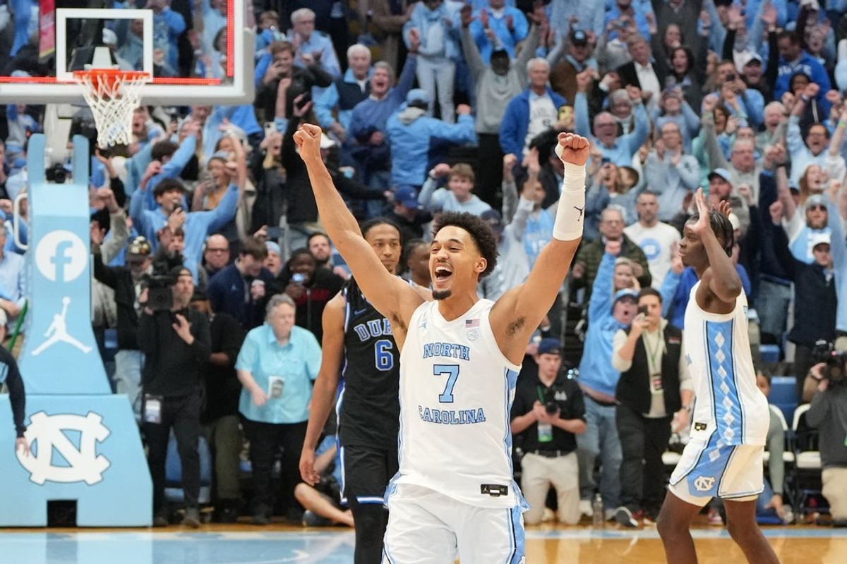 Feb 7, 2026; Chapel Hill, North Carolina, USA; North Carolina Tar Heels guard Seth Trimble (7) celebrates with teammates after the game at Dean E. Smith Center. Mandatory Credit: Bob Donnan-Imagn Images