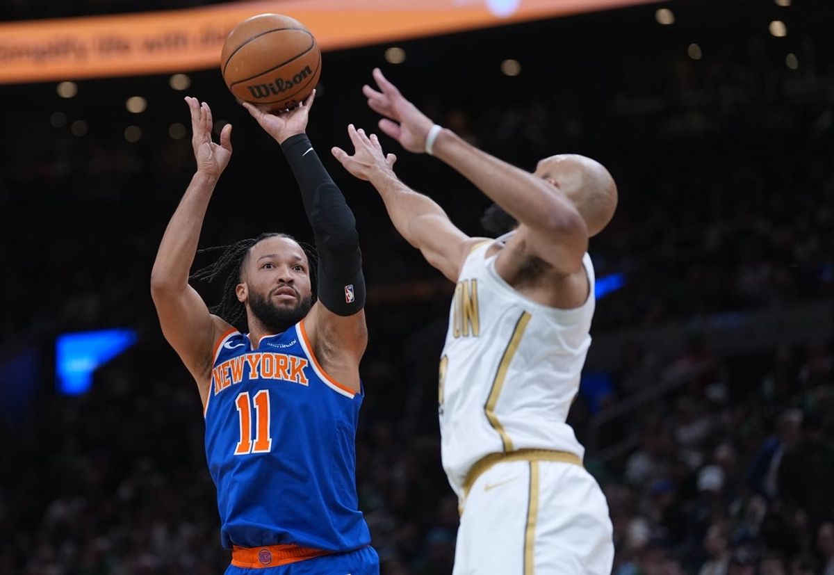 Feb 8, 2026; Boston, Massachusetts, USA; New York Knicks guard Jalen Brunson (11) shoots the ball against Boston Celtics guard Derrick White (9) in the second quarter at TD Garden. Mandatory Credit: David Butler II-Imagn Images