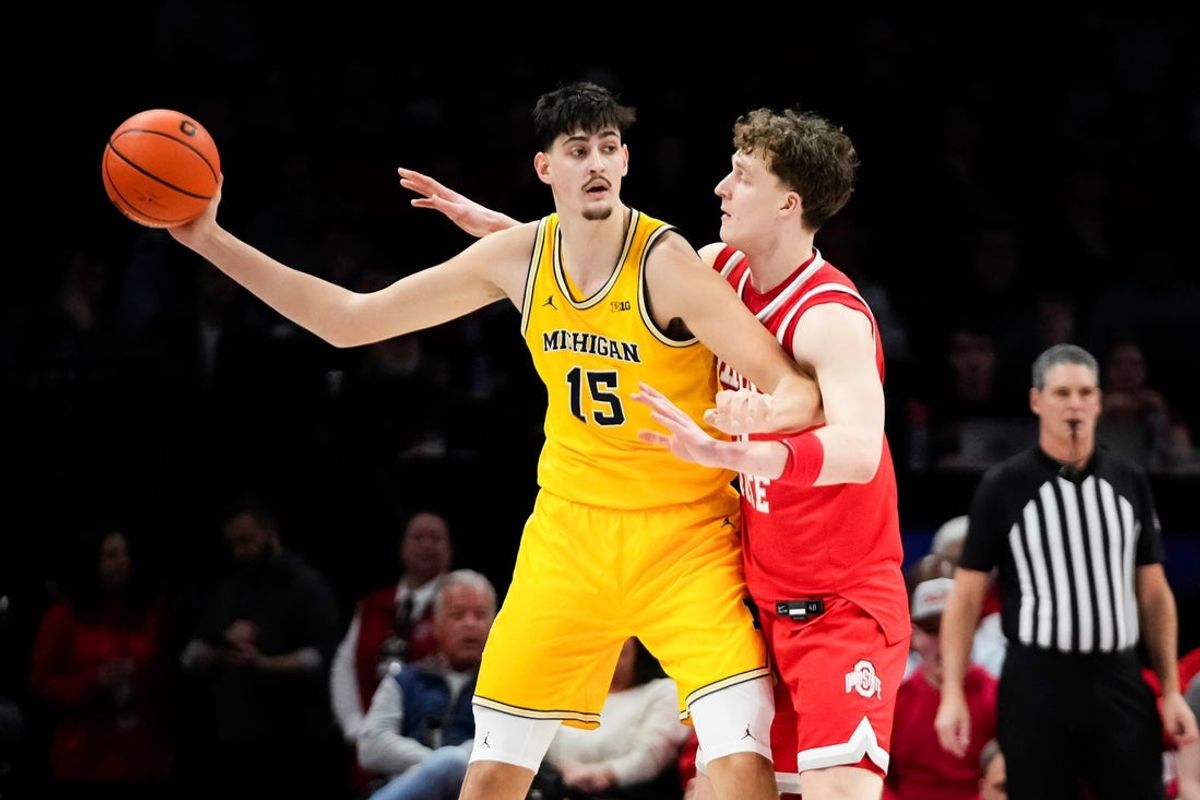 Ohio State Buckeyes center Christoph Tilly (13) defends Michigan Wolverines center Aday Mara (15) during the first half of the NCAA men's basketball game at the Schottenstein Center in Columbus on Feb. 8, 2026.