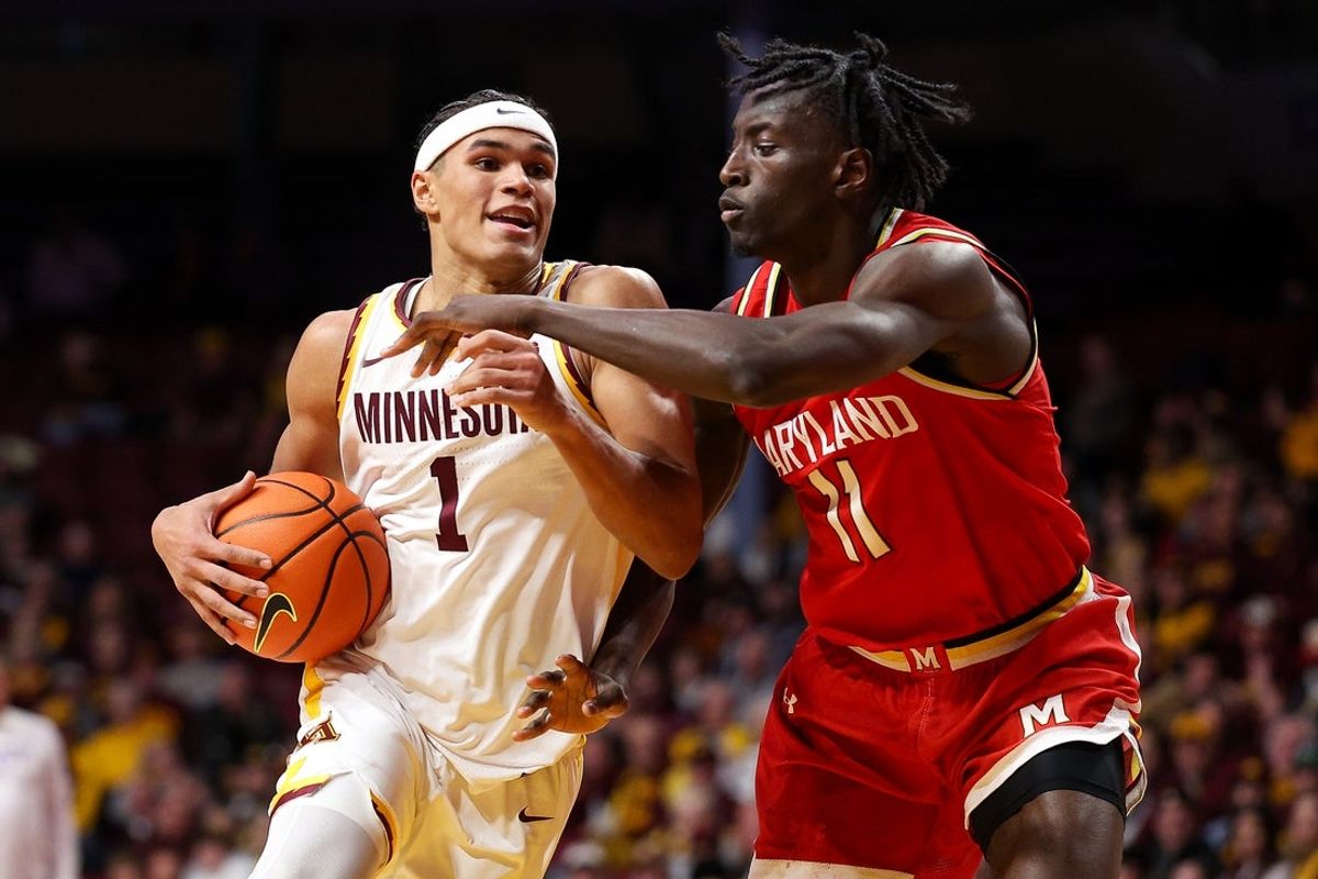 Feb 8, 2026; Minneapolis, Minnesota, USA; Minnesota Golden Gophers guard Isaac Asuma (1) works around Maryland Terrapins guard George Turkson Jr. (11) during the first half at Williams Arena. Mandatory Credit: Matt Krohn-Imagn Images