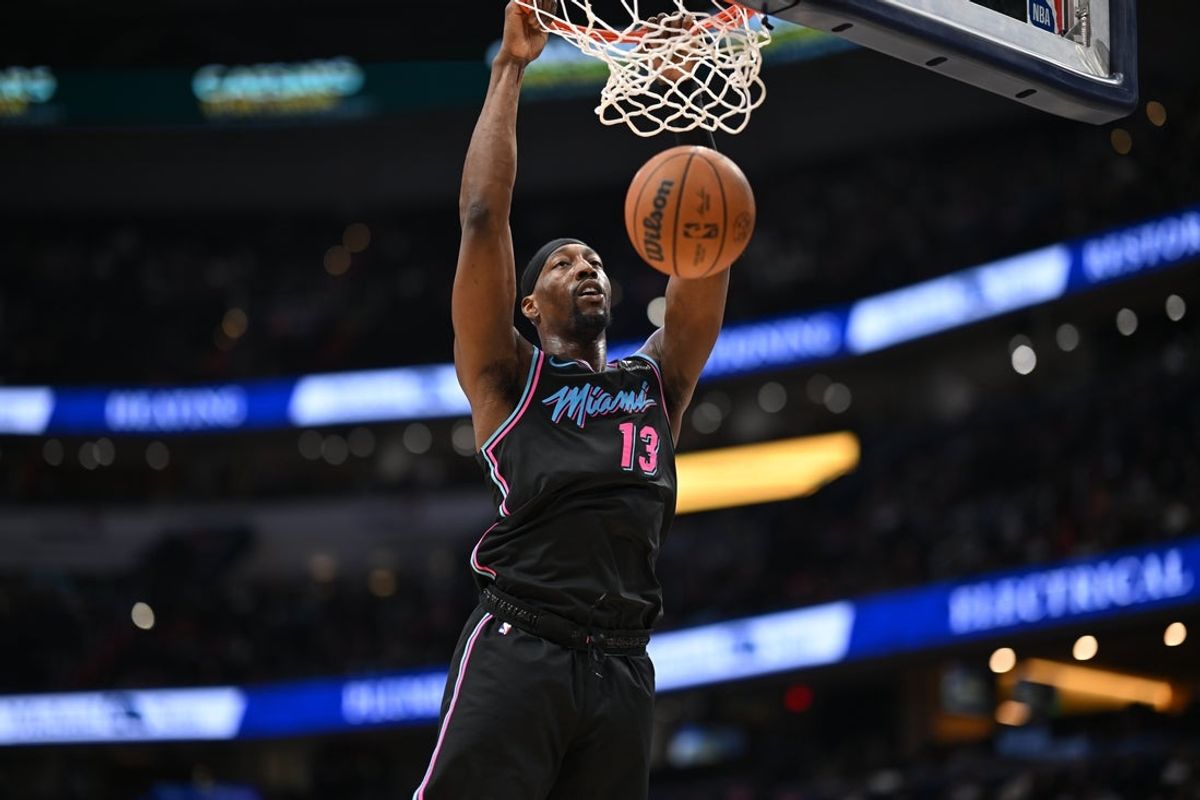 Feb 8, 2026; Washington, District of Columbia, USA;  Miami Heat center Bam Adebayo (13) inks the ball against the Washington Wizards during the second quarter at Capital One Arena. Mandatory Credit: Rafael Suanes-Imagn Images