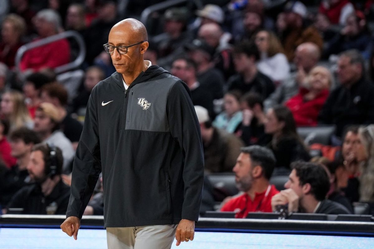 Feb 8, 2026; Cincinnati, Ohio, USA;  UCF Knights head coach Johnny Dawkins reacts after a team’s timeout against the Cincinnati Bearcats in the second half at Fifth Third Arena. Mandatory Credit: Aaron Doster-Imagn Images