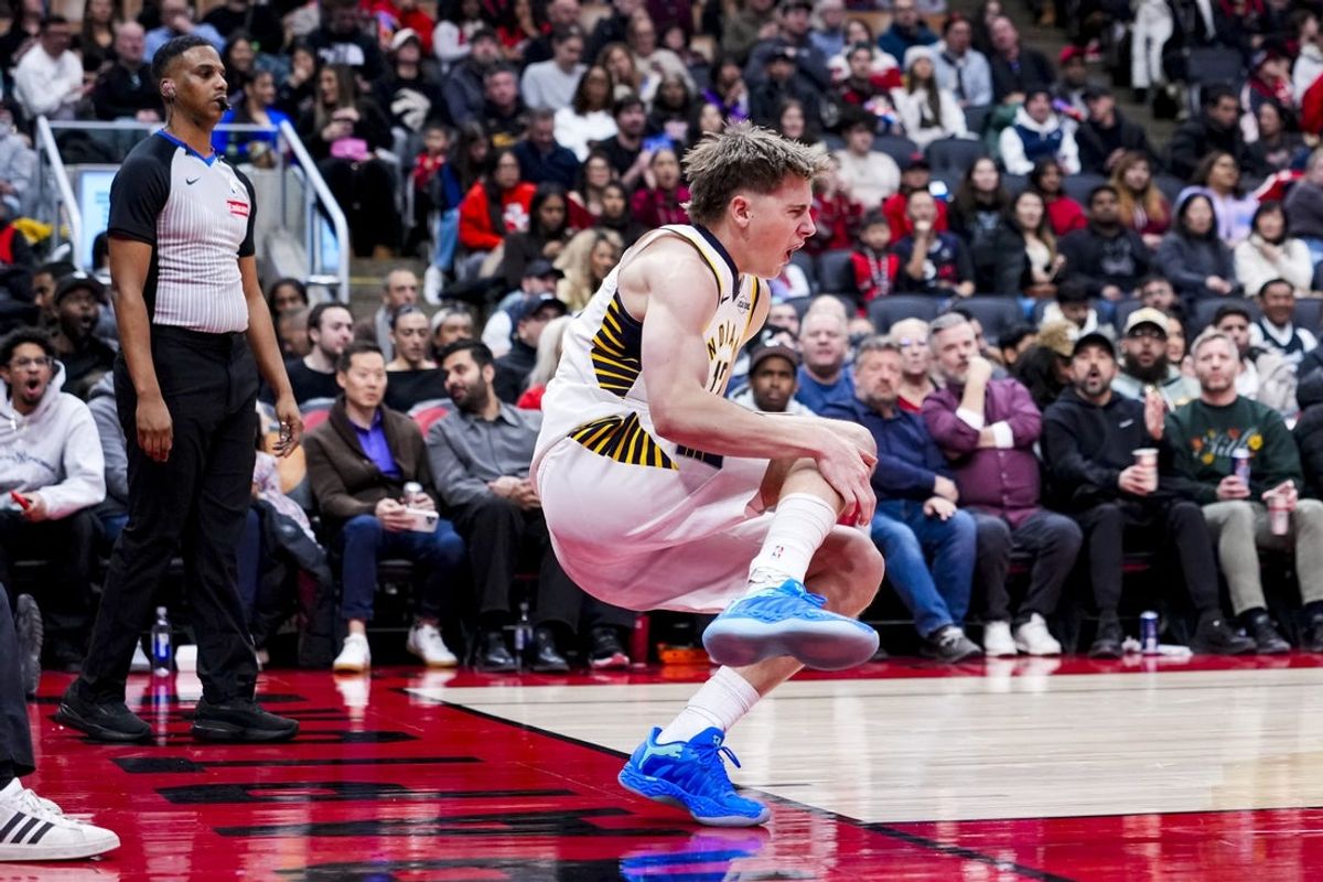 Feb 8, 2026; Toronto, Ontario, CAN; Indiana Pacers guard Johnny Furphy (12) reacts after injuring himself during the second half against the Toronto Raptors at Scotiabank Arena. Mandatory Credit: Kevin Sousa-Imagn Images