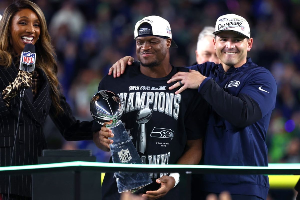 Feb 8, 2026; Santa Clara, CA, USA; Seattle Seahawks head coach Mike MacDonald and running back Kenneth Walker III (9) celebrate with the Vince Lombardi trophy after defeating the New England Patriots in Super Bowl LX at Levi's Stadium. Mandatory Credit: Mark J. Rebilas-Imagn Images