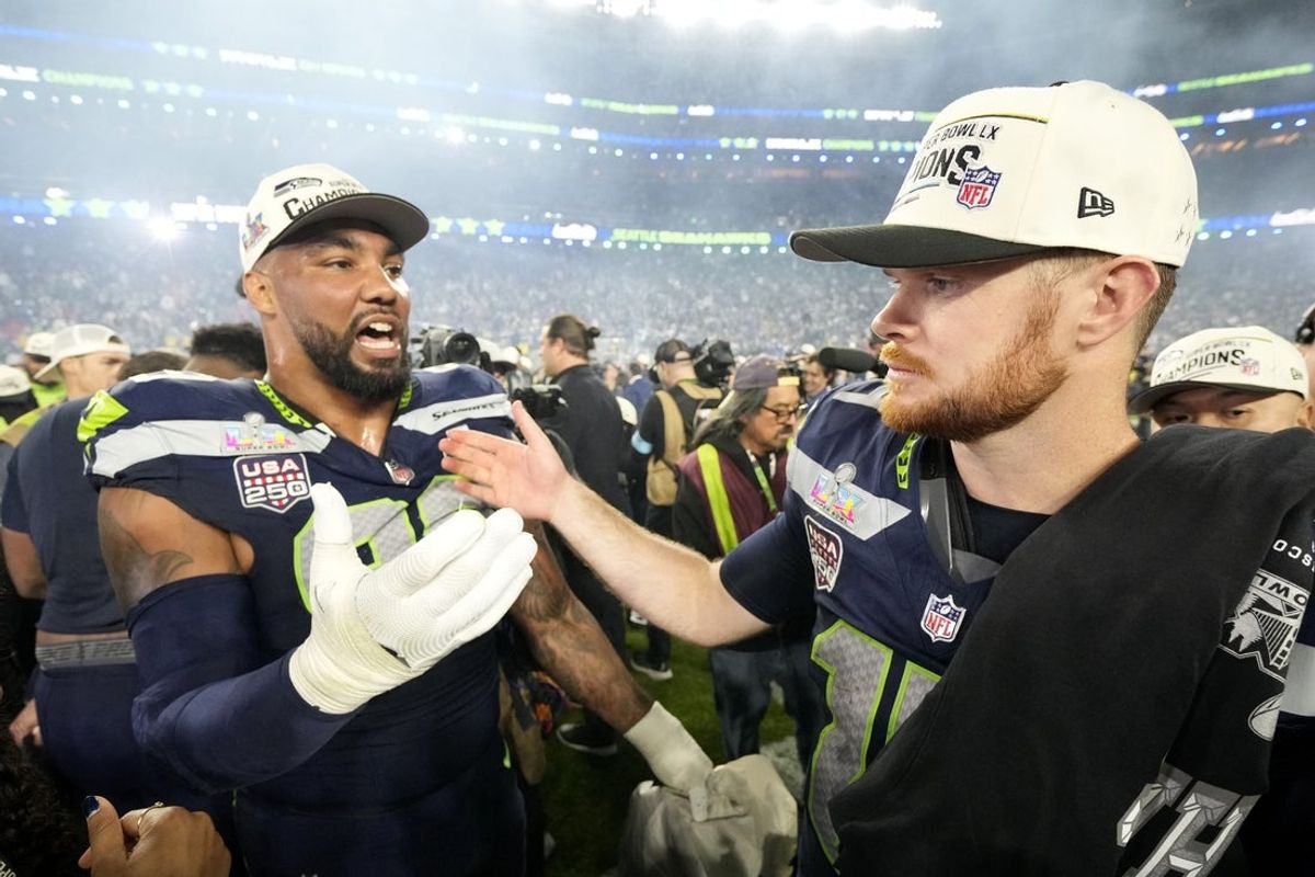 Feb 8, 2026; Santa Clara, CA, USA; Seattle Seahawks quarterback Sam Darnold (14) celebrates with defensive end Leonard Williams (99) after defeating the New England Patriots in Super Bowl LX at Levi's Stadium. Mandatory Credit: Kyle Terada-Imagn Images