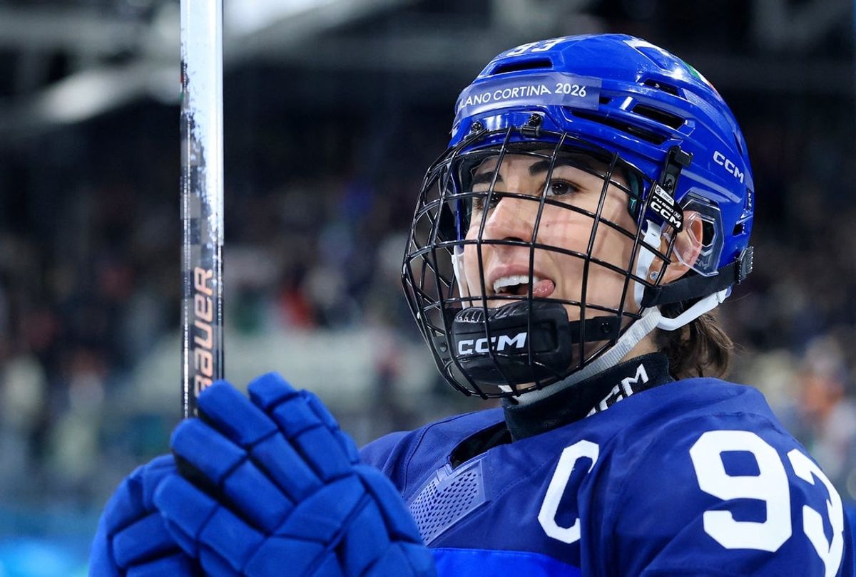 Feb 9, 2026; Milan, Italy; Nadia Mattivi of Italy celebrates after the match against Japan in women's ice hockey group B play during the Milano Cortina 2026 Olympic Winter Games at Milano Rho Ice Hockey Arena. Mandatory Credit: Katie Stratman-Imagn Images