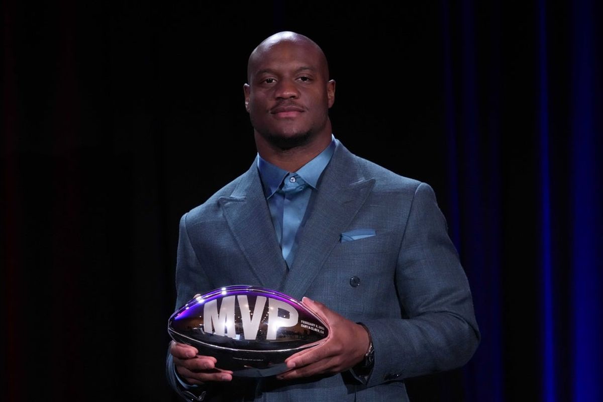 Feb 9, 2026; San Francisco, CA, USA; Seattle Seahawks running back Kenneth Walker III poses with the MVP trophy during the Super Bowl LX winning head coach and most valuable player press conference at Moscone Center. Mandatory Credit: Kirby Lee-Imagn Images