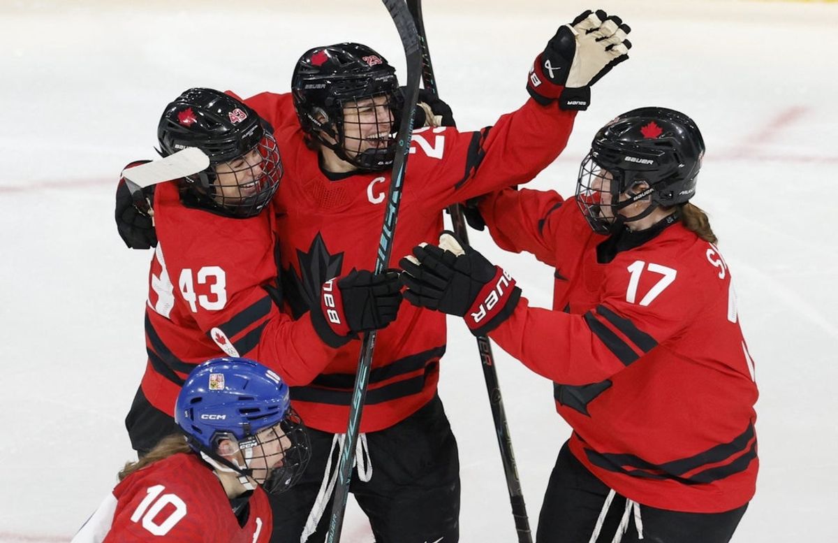 [US, Mexico & Canada customers only] Feb 8, 2026; Milan, Italy; Kristin O'Neill of Canada celebrates scoring their first goal with Marie-Philip Poulin of Canada and Ella Shelton of Canada  against Czechia in women's ice hockey group B play during the Milano Cortina 2026 Olympic Winter Games at Milano Rho Ice Hockey Arena. Mandatory Credit: David W Cerny/Reuters via Imagn Images