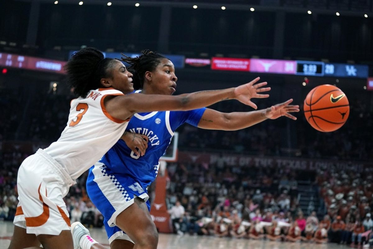 Feb 9, 2026; Austin, Texas, USA; Texas Longhorns guard Rori Harmon (3) and Kentucky Wildcats guard Jordan Obi (0) chase the ball during the second quarter at Moody Center. Mandatory Credit: Dustin Safranek-Imagn Images