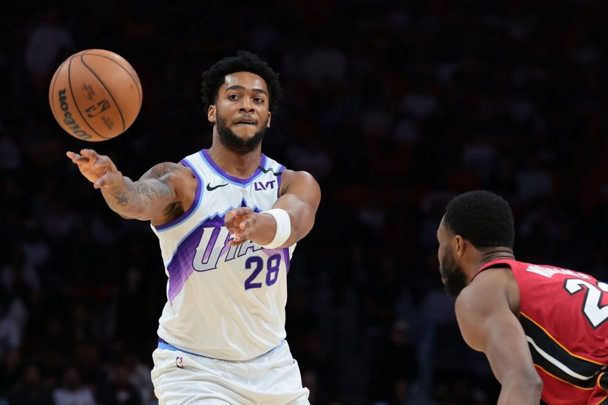 Feb 9, 2026; Miami, Florida, USA; Utah Jazz forward Brice Sensabaugh (28) passes the basketball against Miami Heat forward Andrew Wiggins (22) during the second quarter at Kaseya Center. Mandatory Credit: Sam Navarro-Imagn Images